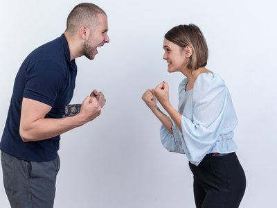 young-beautiful-couple-man-woman-quarreling-shouting-with-clenched-fists-standing-white-wall